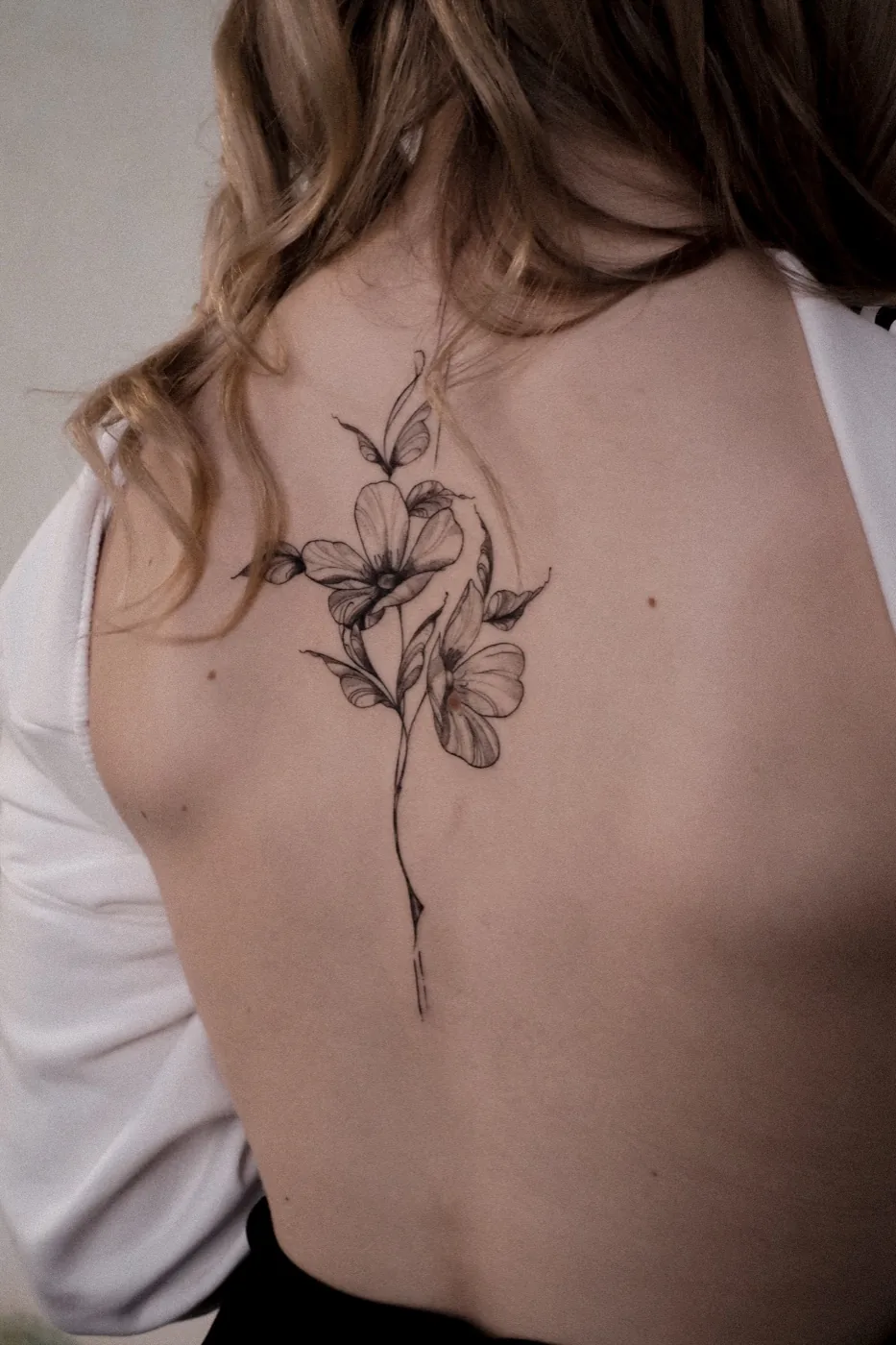 Fine-line floral spine piece