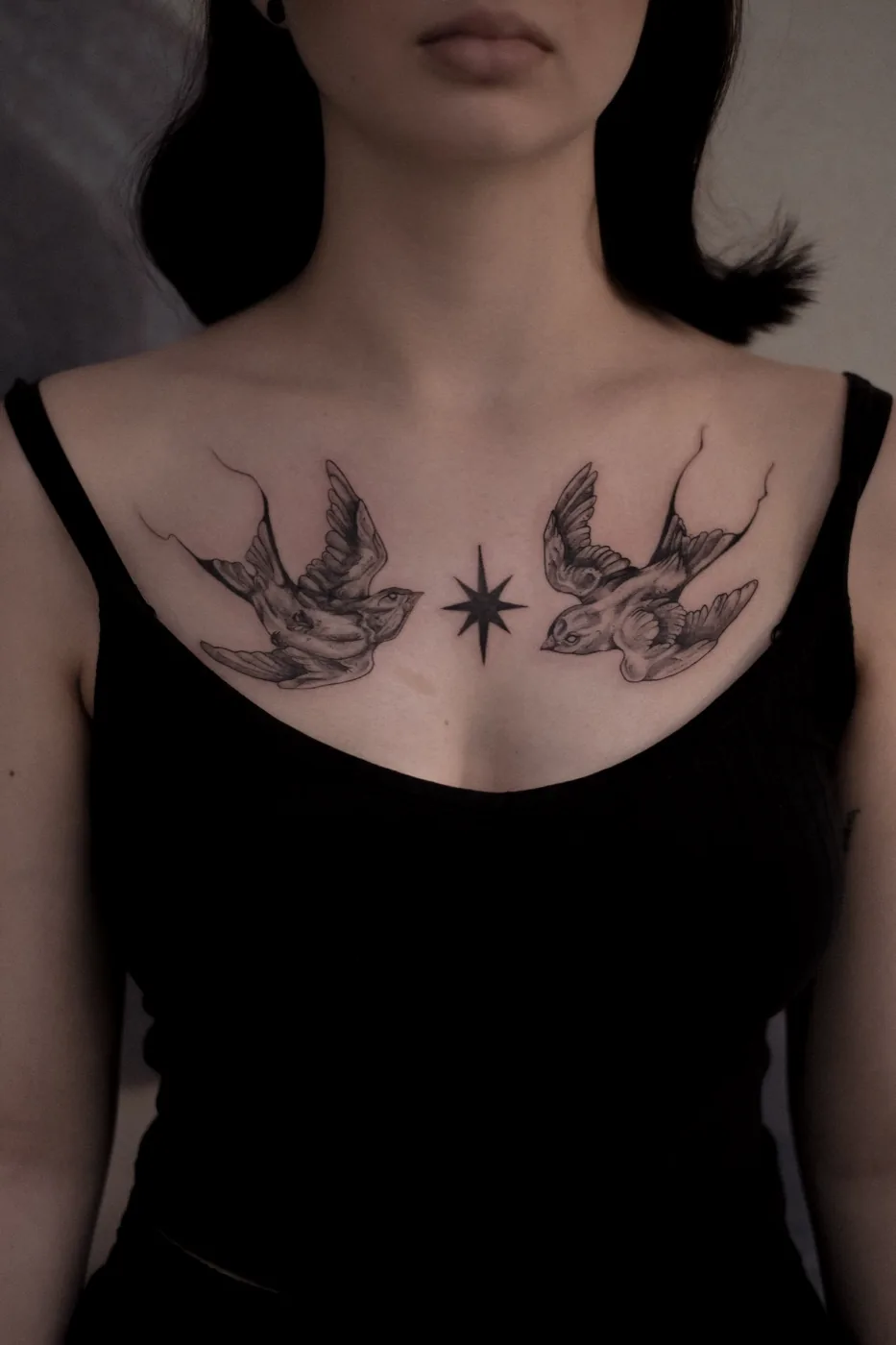 Two swallows with star on collarbone